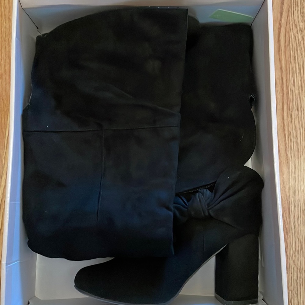Super cute slightly used black knee high boots.